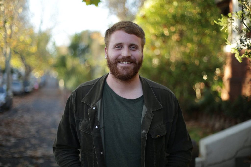 Smiling man outdoors on a sunny day